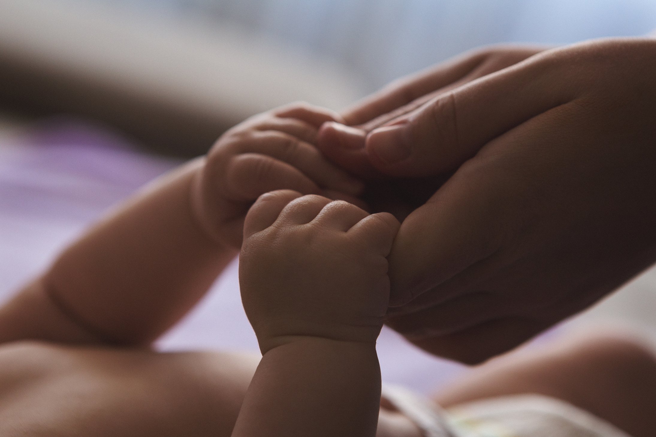 Mother and baby hands